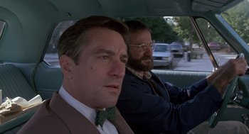 Movie still from “Awakenings” (1990), directed by Penny Marshall – Two men in suits and ties driving in a car; Close Up shot, Over the shoulder angle