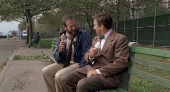 Movie still from “Awakenings” (1990), directed by Penny Marshall – A couple of men sitting on top of a wooden bench; Medium shot, Over the shoulder angle