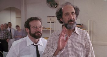 Movie still from “Awakenings” (1990), directed by Penny Marshall – A man with a goatee and beard and a man with a goatee; Medium shot, Over the shoulder angle