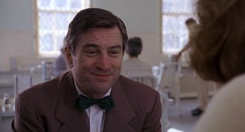 Movie still from “Awakenings” (1990), directed by Penny Marshall – A person wearing a suit and a bow tie; Close Up shot, Low angle