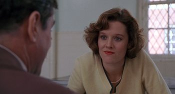 Movie still from “Awakenings” (1990), directed by Penny Marshall – A woman sitting in front of a man in front of a mirror; Close Up shot, Over the shoulder angle