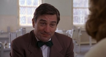 Movie still from “Awakenings” (1990), directed by Penny Marshall – A person wearing a suit and a bow tie; Close Up shot, Over the shoulder angle
