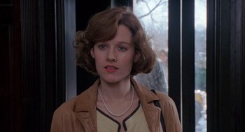 Movie still from “Awakenings” (1990), directed by Penny Marshall – A person wearing a necklace; Close Up shot, Over the shoulder angle