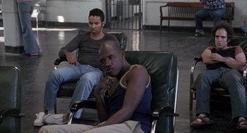 Movie still from “Awakenings” (1990), directed by Penny Marshall – Two men sitting on a chair in a room; Medium shot, High angle