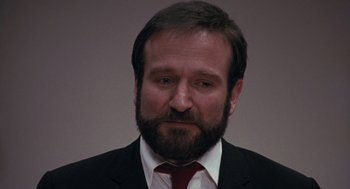 Movie still from “Awakenings” (1990), directed by Penny Marshall – A person wearing a suit and tie; Close Up shot, Over the shoulder angle