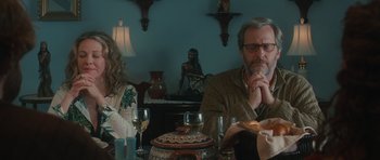 Movie still from “Away We Go” (2009), directed by Sam Mendes – A man and a woman sitting at a dinner table; Medium shot, Over the shoulder angle