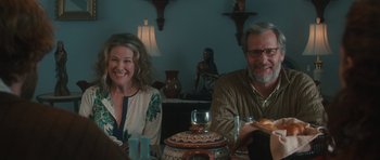 Movie still from “Away We Go” (2009), directed by Sam Mendes – A man and a woman are sitting at a table; Medium shot, Over the shoulder angle