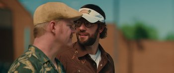 Movie still from “Away We Go” (2009), directed by Sam Mendes – Two men talking to each other while wearing hats; Close Up shot, Over the shoulder angle