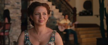 Movie still from “Away We Go” (2009), directed by Sam Mendes – A beautiful woman with a guitar in front of a man; Close Up shot, Over the shoulder angle