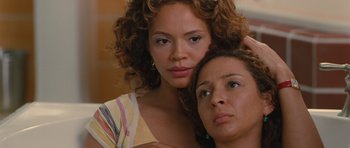 Movie still from “Away We Go” (2009), directed by Sam Mendes – Two beautiful women posing for a picture together; Close Up shot, High angle