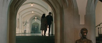 Movie still from “Away We Go” (2009), directed by Sam Mendes – A man and a woman are walking down the stairs; Wide shot, Low angle