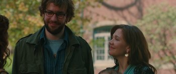 Movie still from “Away We Go” (2009), directed by Sam Mendes – A man and a woman standing next to each other with a baby; Close Up shot, Over the shoulder angle