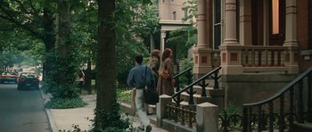 Movie still from “Away We Go” (2009), directed by Sam Mendes – A man and two women walking down the steps of a house; Extreme Wide shot, High angle