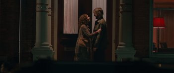 Movie still from “Away We Go” (2009), directed by Sam Mendes – A man and a woman standing next to each other; Wide shot, Over the shoulder angle