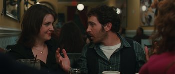 Movie still from “Away We Go” (2009), directed by Sam Mendes – A man and a woman talking to each other at a table; Medium shot, Over the shoulder angle
