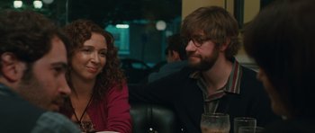 Movie still from “Away We Go” (2009), directed by Sam Mendes – A man and a woman sitting at a table in a restaurant; Close Up shot, Over the shoulder angle