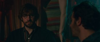 Movie still from “Away We Go” (2009), directed by Sam Mendes – A man and a woman in a dark room; Close Up shot, Over the shoulder angle