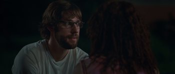 Movie still from “Away We Go” (2009), directed by Sam Mendes – A man wearing glasses is talking to a woman; Close Up shot, Over the shoulder angle
