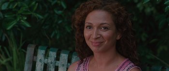 Movie still from “Away We Go” (2009), directed by Sam Mendes – A person sitting on a park bench; Close Up shot, Over the shoulder angle