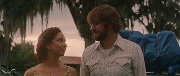 Movie still from “Away We Go” (2009), directed by Sam Mendes – A man and a woman standing next to each other; Medium shot, Over the shoulder angle