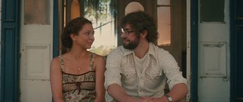 Movie still from “Away We Go” (2009), directed by Sam Mendes – A man and a woman sitting next to each other; Medium shot, Over the shoulder angle