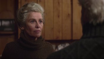 Movie still from “Away from Her” (2006), directed by Sarah Polley – An older woman wearing a brown sweater is talking to a man; Close Up shot, Over the shoulder angle