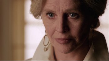 Movie still from “Away from Her” (2006), directed by Sarah Polley – An older woman with blue eyes looking at the camera; Close Up shot, Low angle