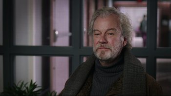 Movie still from “Away from Her” (2006), directed by Sarah Polley – An older man sitting in front of a window; Close Up shot, Over the shoulder angle