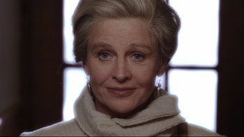 Movie still from “Away from Her” (2006), directed by Sarah Polley – An older woman wearing a white sweater and a white scarf; Close Up shot, Low angle