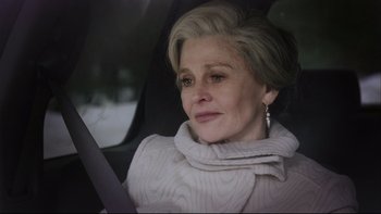 Movie still from “Away from Her” (2006), directed by Sarah Polley – An older woman sitting in the back seat of a car; Close Up shot, Over the shoulder angle