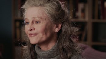 Movie still from “Away from Her” (2006), directed by Sarah Polley – An older woman wearing a gray sweater and a gray sweater; Close Up shot, Over the shoulder angle