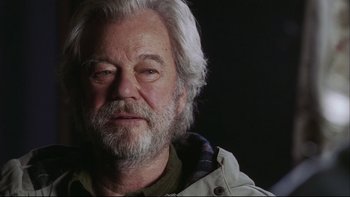 Movie still from “Away from Her” (2006), directed by Sarah Polley – An older man with white hair and a beard; Close Up shot, Low angle