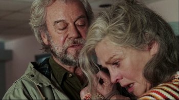 Movie still from “Away from Her” (2006), directed by Sarah Polley – An older man and a younger woman looking at each other; Close Up shot, Over the shoulder angle