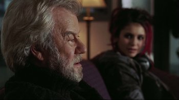 Movie still from “Away from Her” (2006), directed by Sarah Polley – An older man and a young woman sitting on a couch; Close Up shot, Over the shoulder angle