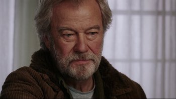 Movie still from “Away from Her” (2006), directed by Sarah Polley – An older man with a beard and a jacket; Close Up shot, Over the shoulder angle