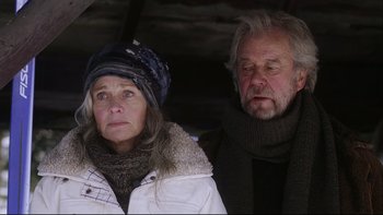 Movie still from “Away from Her” (2006), directed by Sarah Polley – An older man and a younger woman standing next to each other; Close Up shot, Low angle