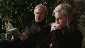 Movie still from “Away from Her” (2006), directed by Sarah Polley – An older man and woman sitting next to each other; Close Up shot, Over the shoulder angle