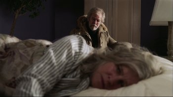 Movie still from “Away from Her” (2006), directed by Sarah Polley – An older man and a younger woman in a bed; Medium shot, Over the shoulder angle