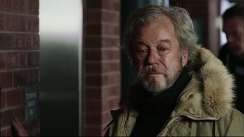 Movie still from “Away from Her” (2006), directed by Sarah Polley – An older man with grey hair and a goatee; Close Up shot, Over the shoulder angle