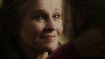 Movie still from “Away from Her” (2006), directed by Sarah Polley – An older woman with blue eyes looking into the camera; Close Up shot, Over the shoulder angle