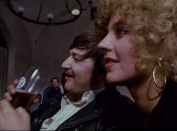 Movie still from “Baal” (1970), directed by Volker Schlöndorff – A man and a woman sitting next to each other; Close Up shot, Over the shoulder angle