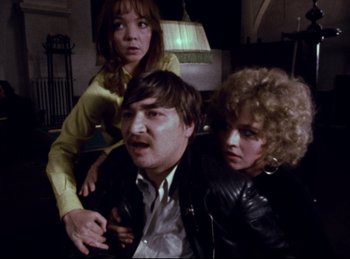 Movie still from “Baal” (1970), directed by Volker Schlöndorff – Two women and a man in a room; Medium shot, High angle
