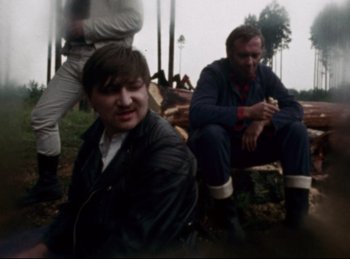 Movie still from “Baal” (1970), directed by Volker Schlöndorff – Two men sitting on a bench in the woods; Medium shot, Over the shoulder angle