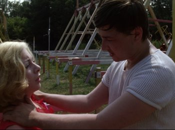 Movie still from “Baal” (1970), directed by Volker Schlöndorff – A man and a woman are playing a game; Medium shot, Over the shoulder angle