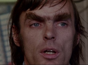 Movie still from “Baal” (1970), directed by Volker Schlöndorff – A man's eyes and face; Close Up shot, Low angle