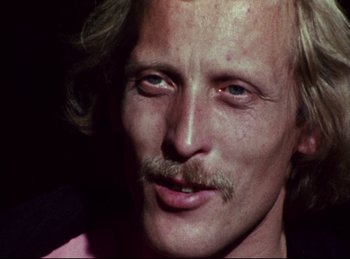 Movie still from “Baal” (1970), directed by Volker Schlöndorff – A person with a mustache; Close Up shot, Low angle