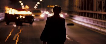 Movie still from “Stay” (2005), directed by Marc Forster – A person standing in the middle of a street at night; Wide shot, Over the shoulder angle