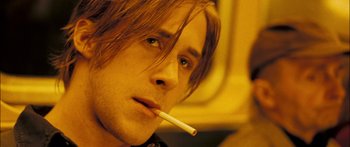 Movie still from “Stay” (2005), directed by Marc Forster – A person holding a cigarette in his mouth; Close Up shot, Over the shoulder angle