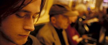 Movie still from “Stay” (2005), directed by Marc Forster – A man and a woman sitting next to each other on a bus; Close Up shot, Low angle
