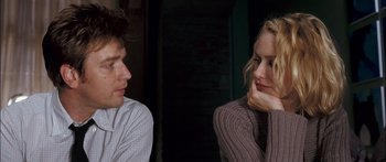 Movie still from “Stay” (2005), directed by Marc Forster – A man and a woman sitting next to each other in front of each other; Close Up shot, Over the shoulder angle